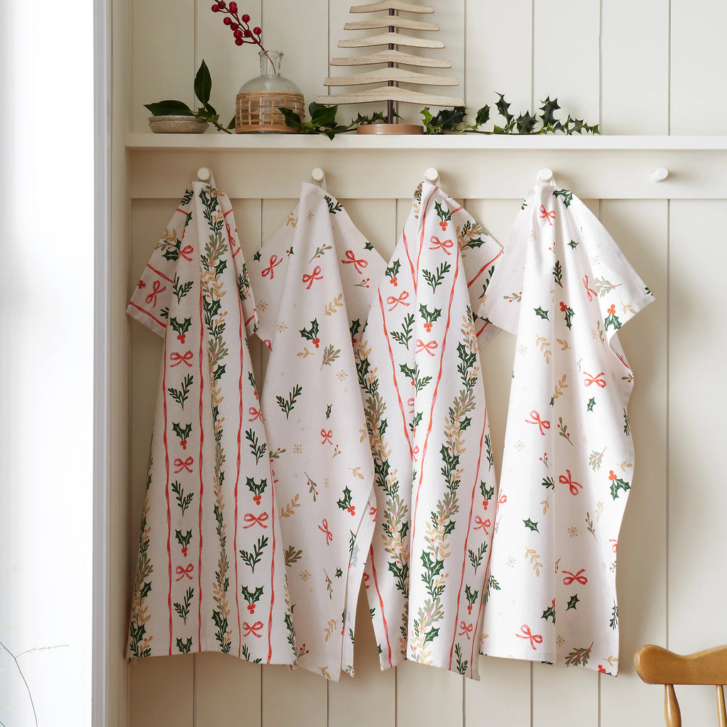 Catherine Lansfield Christmas Holly Stripe Cotton Tea Towels 4 Pack in Cream / Red