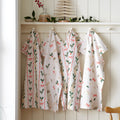 Catherine Lansfield Christmas Holly Stripe Cotton Tea Towels 4 Pack in Cream / Red