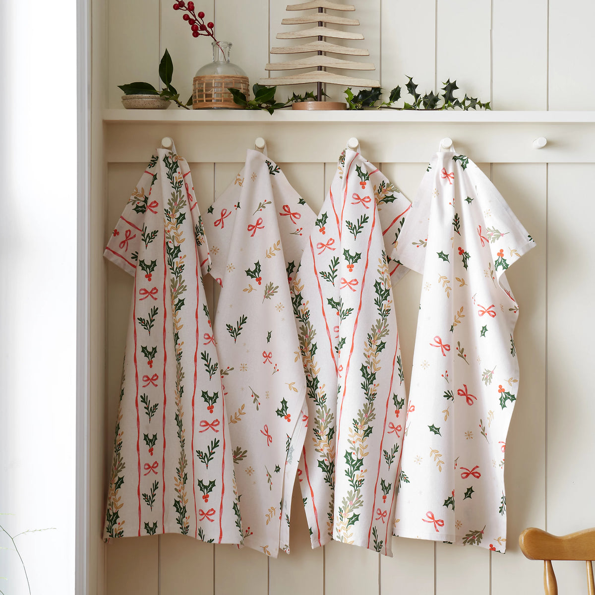 Catherine Lansfield Christmas Holly Stripe Cotton Tea Towels 4 Pack in Cream / Red