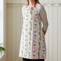 Catherine Lansfield Christmas Holly Stripe Cotton Kitchen Apron in Cream / Red