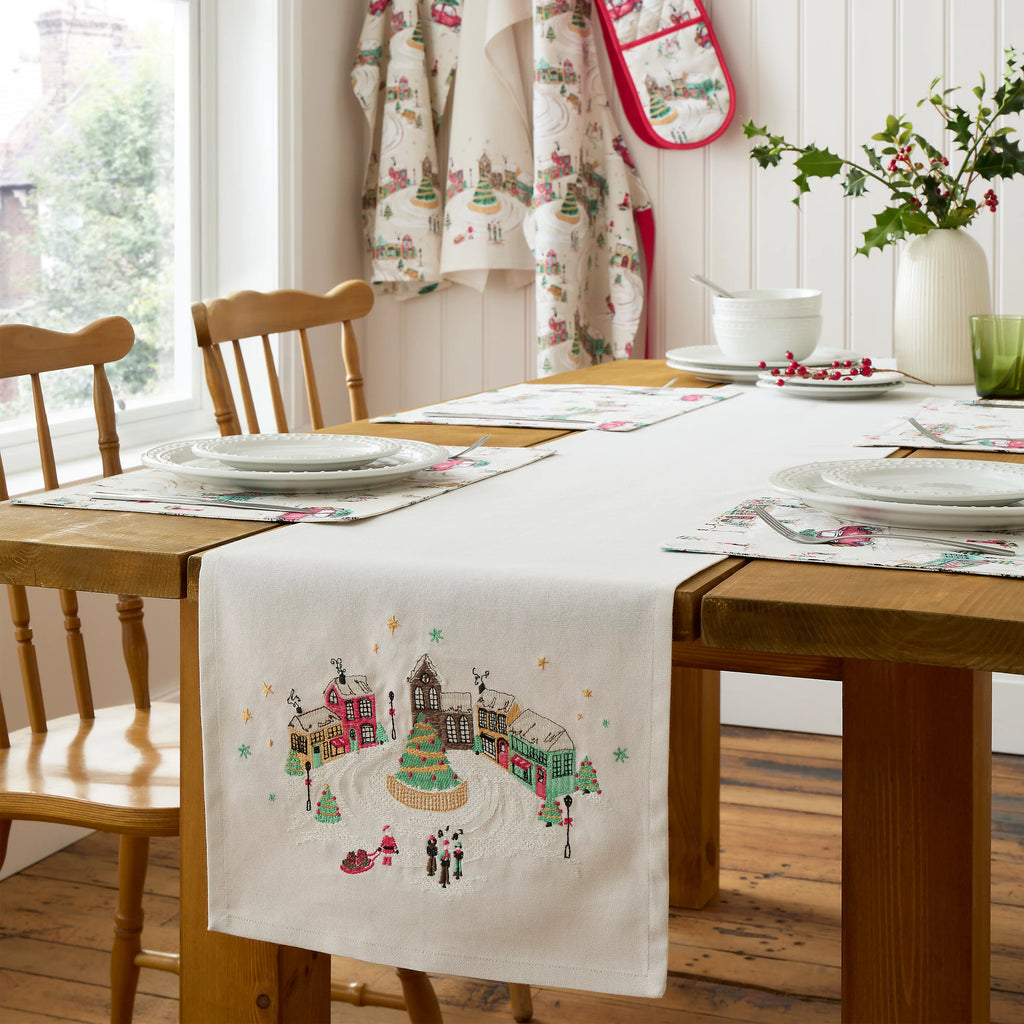 Catherine Lansfield Christmas Town Cotton Table Runner in Natural 33 x 220cm