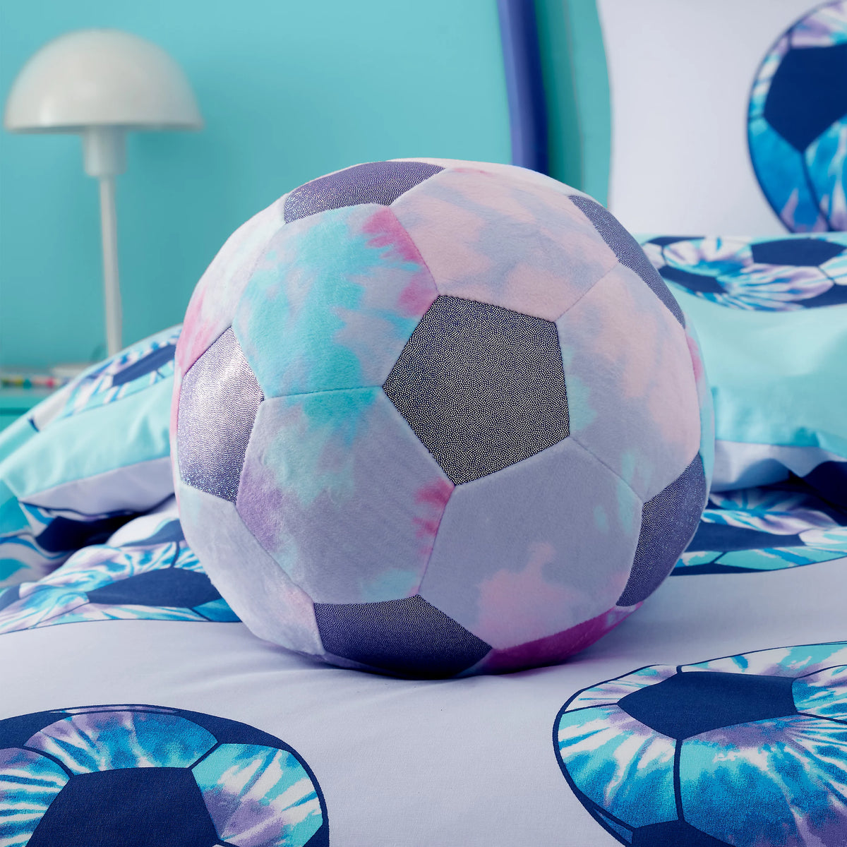 Catherine Lansfield Kids Tie Dye Football Shaped Cushion in Lilac
