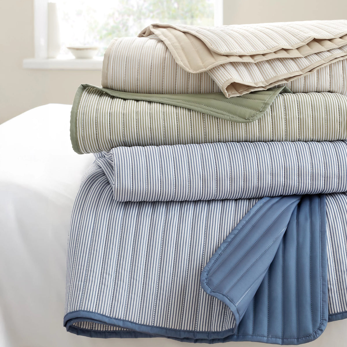 Catherine Lansfield Stripe Quilted Reversible Bedspread in Blue 220 x 230cm