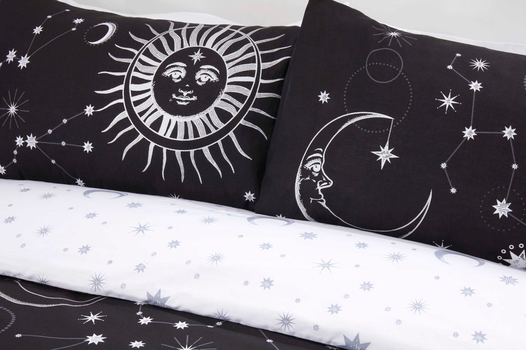 Close-up of the metallic-effect sun and moon design on the Celestial black duvet cover set.