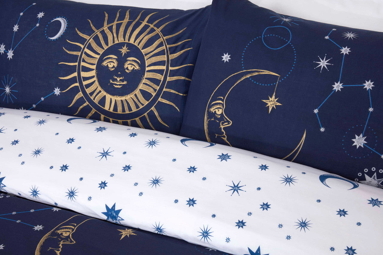 Close-up of the metallic-effect sun and moon design on the Celestial navy duvet cover set.
