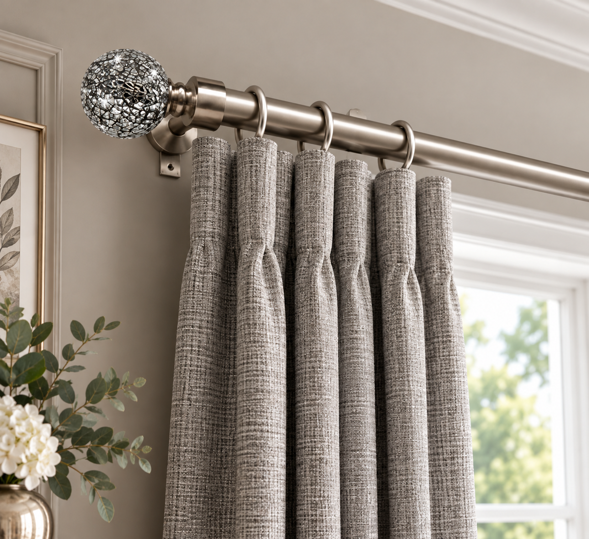 Cracked Glass brushed satin curtain pole styled with curtains in an elegant room.