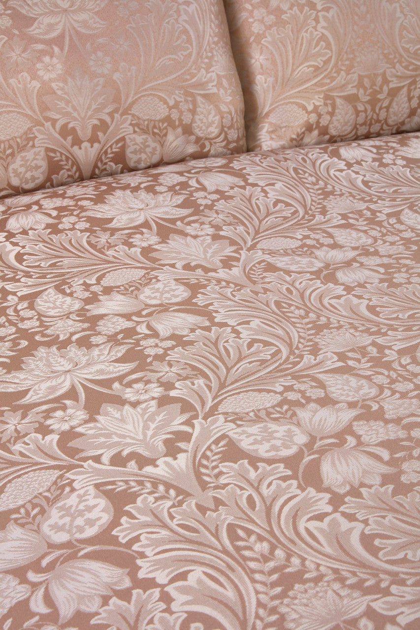 Close-up of the textured jacquard fabric on the Luxury Damask duvet cover set.