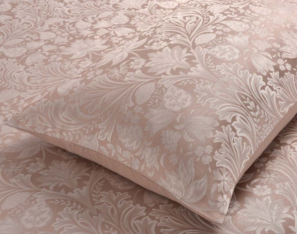 Close-up of the ornate damask pattern on the Luxury Damask Jacquard duvet cover set.