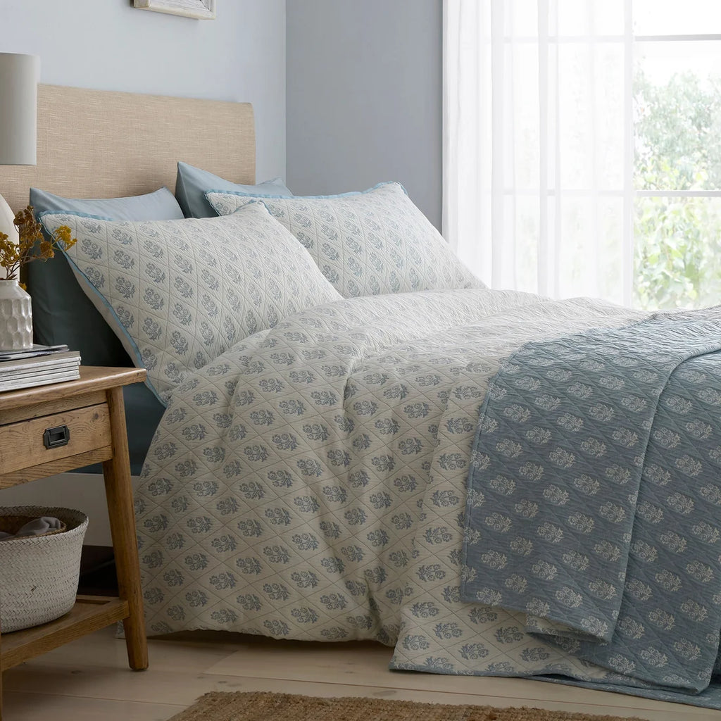 Dreams & Drapes Block Floral blue duvet cover set styled in an elegant bedroom.