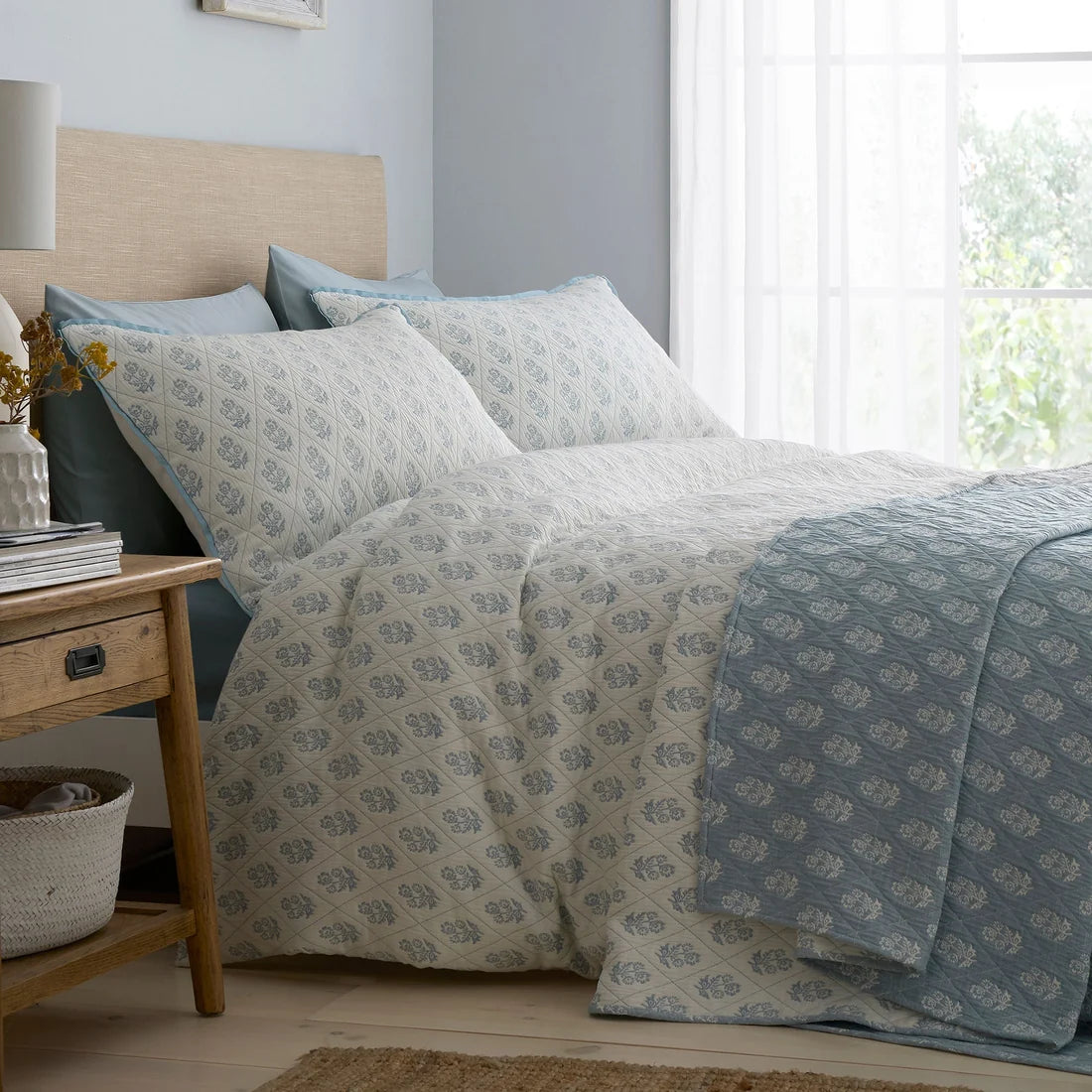 Dreams & Drapes Block Floral blue duvet cover set styled in an elegant bedroom.