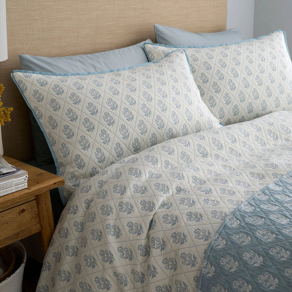 Close-up of the floral diamond jacquard weave on the Dreams & Drapes Block Floral duvet cover set.