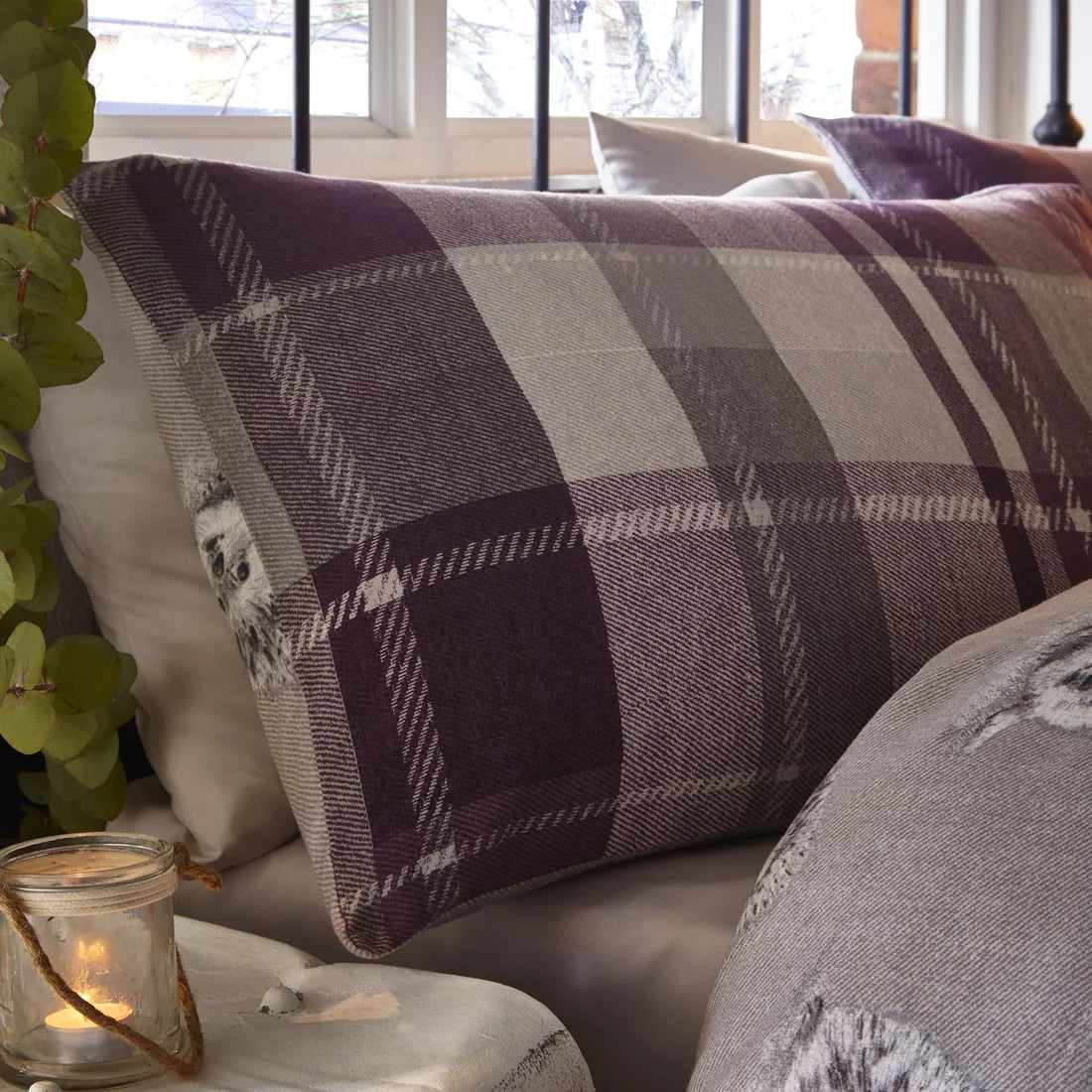 Close-up of the oversized plum check pattern on the Dreams & Drapes Colville Check duvet cover set.