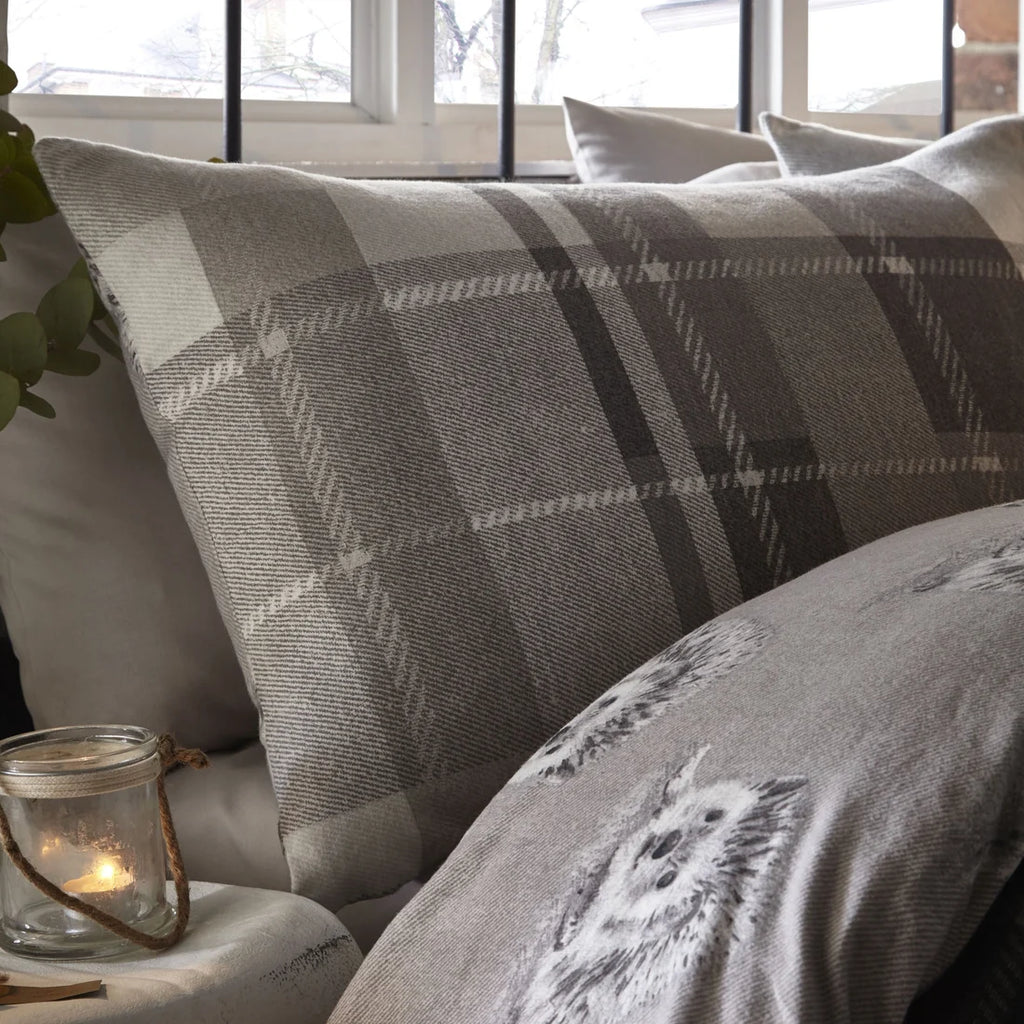 Close-up of the oversized grey check pattern on the Dreams & Drapes Colville Check duvet cover set.