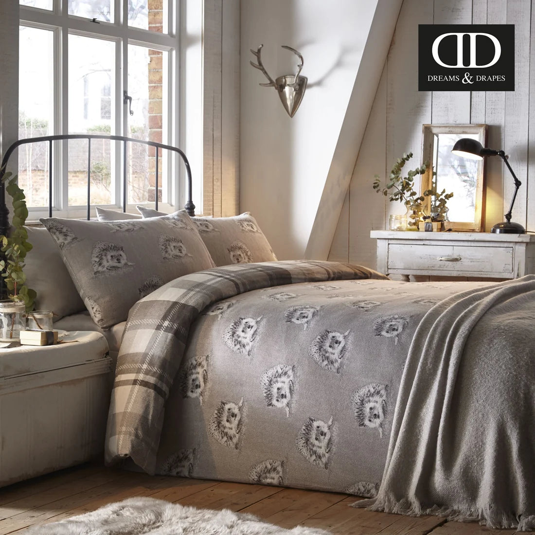 Repeating hedgehog reverse on the Dreams & Drapes Colville Check duvet cover set.