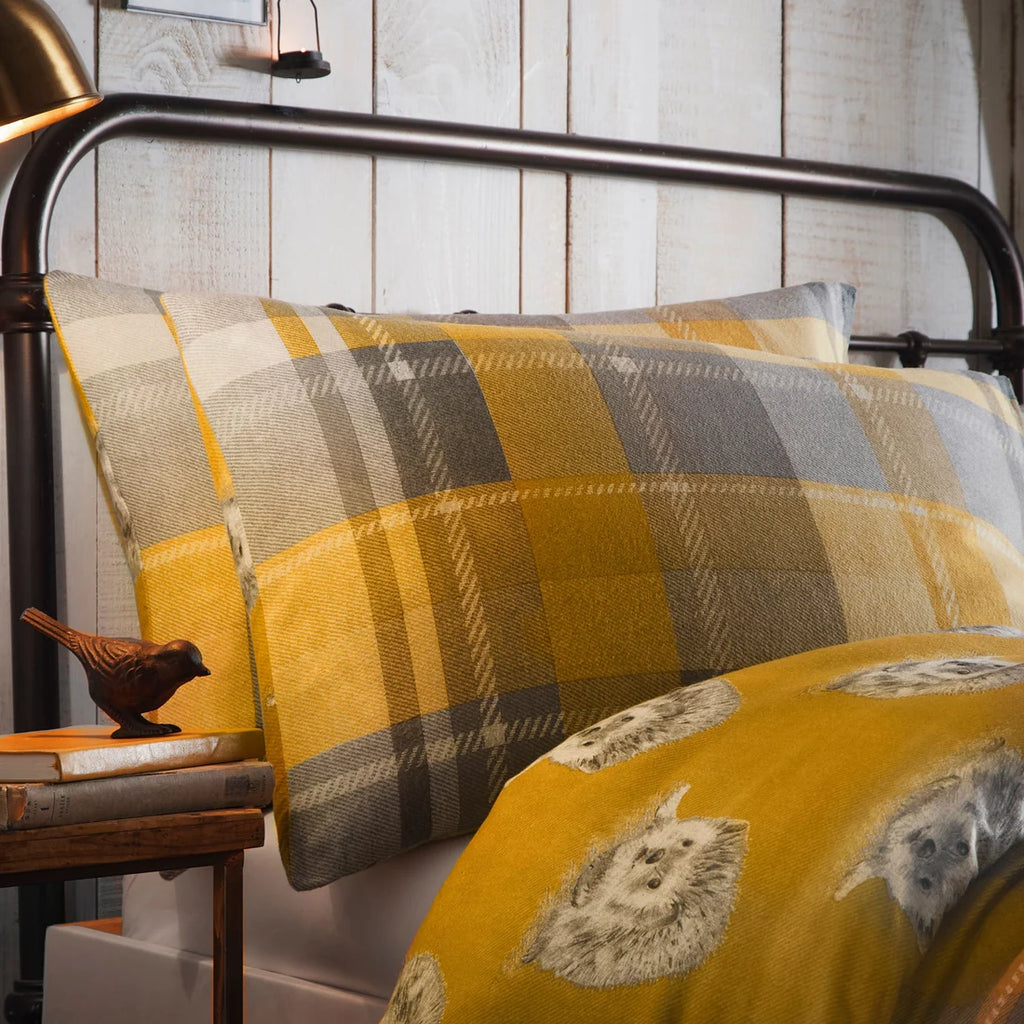 Close-up of the oversized ochre and grey check pattern on the Dreams & Drapes Colville Check duvet cover set.