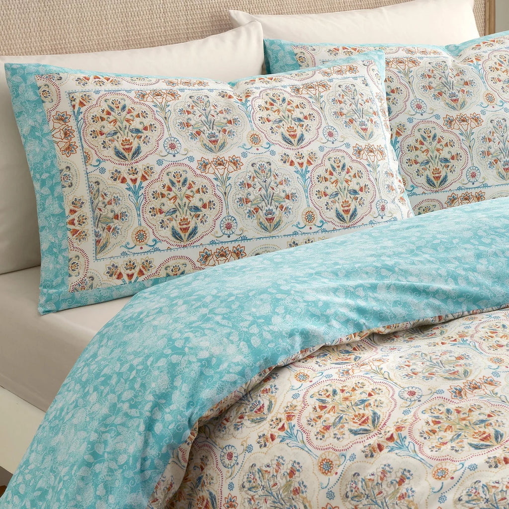 Close-up of the ornamental floral pattern on the Dreams & Drapes Edena Decorative Floral duvet cover set.