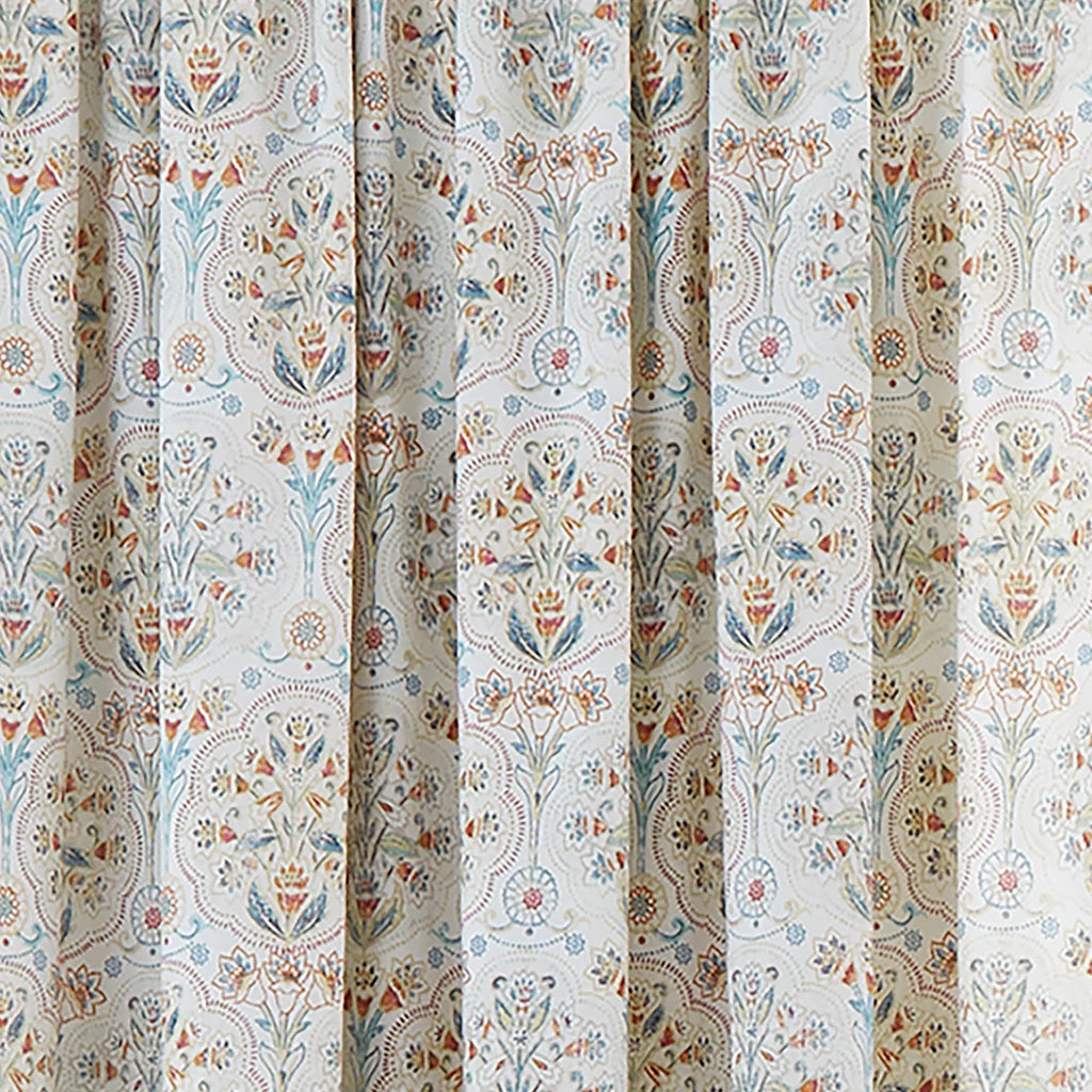 Close-up of the teal, gold and coral ornamental floral design on the Dreams & Drapes Edena curtains.