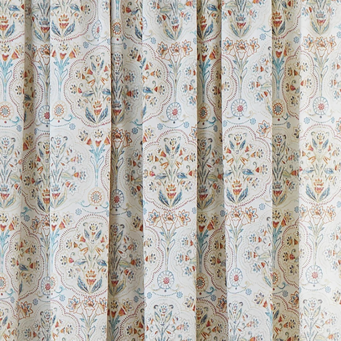 Close-up of the teal, gold and coral ornamental floral design on the Dreams & Drapes Edena curtains.