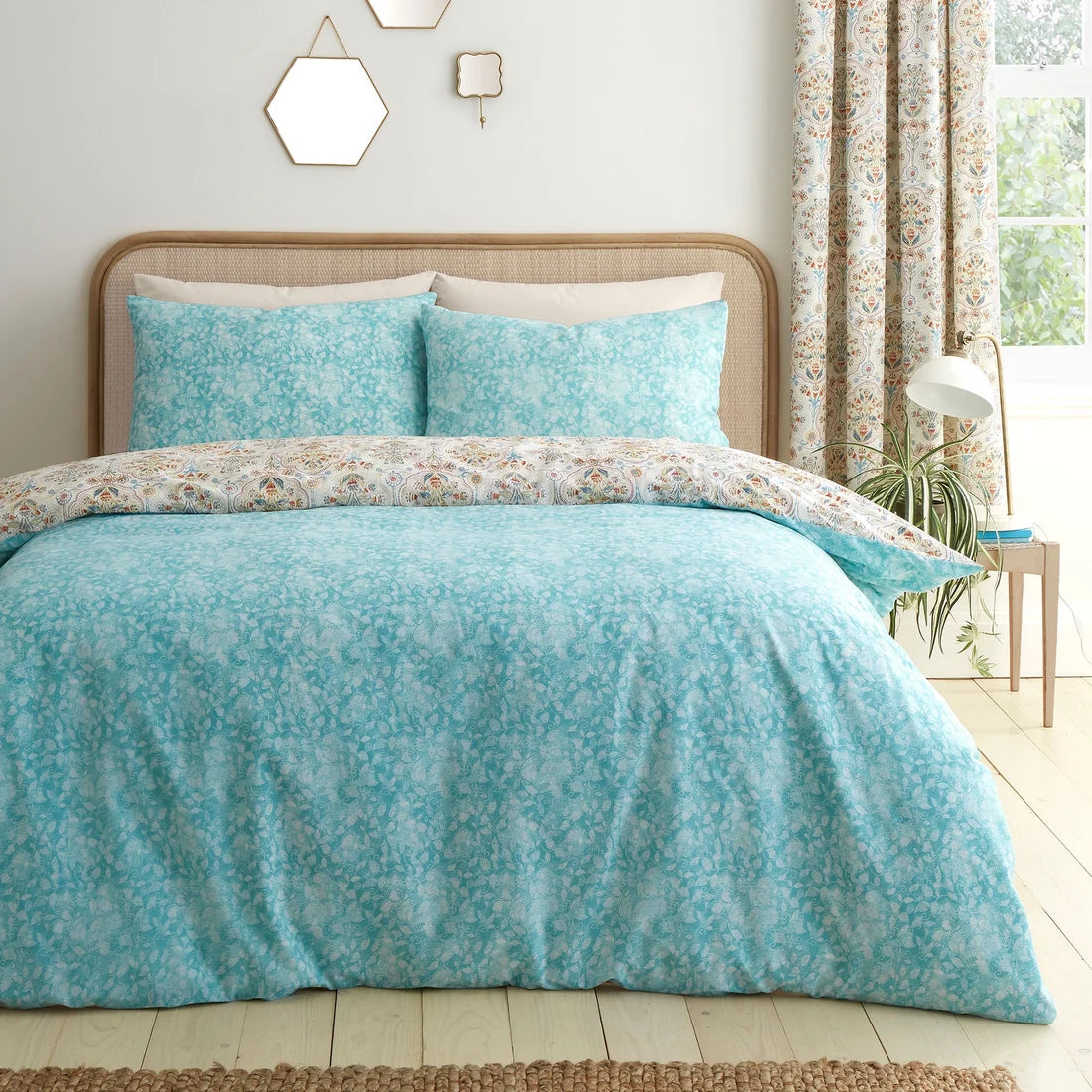 Coordinating teal floral reverse on the Dreams & Drapes Edena Decorative Floral duvet cover set.