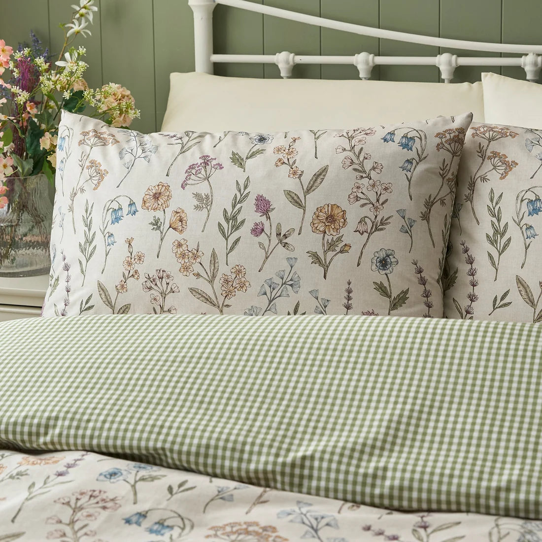 Close-up of the delicate wildflower and trailing stem design on the Dreams & Drapes Meadow Floral duvet cover set.