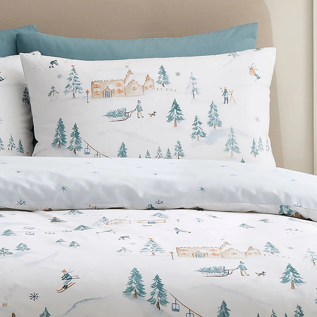 Close-up of the alpine ski village, snow-covered trees and chalet design on the Ski Village duvet cover set.