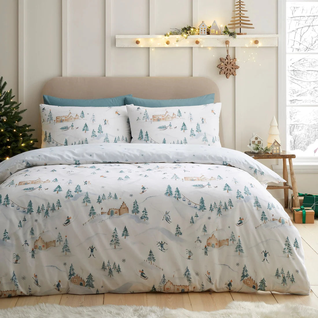 Dreams & Drapes Ski Village Christmas duvet cover set in natural with alpine winter scene.