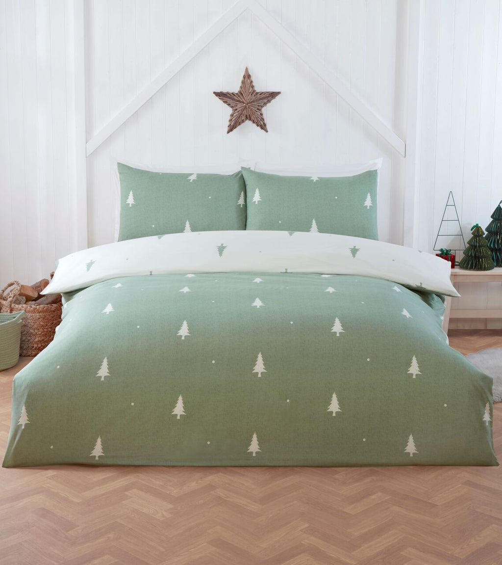 Fir Tree reversible duvet cover set in Sage Green with a white winter tree design.