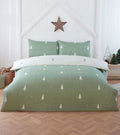 Fir Tree reversible duvet cover set in Sage Green with a white winter tree design.
