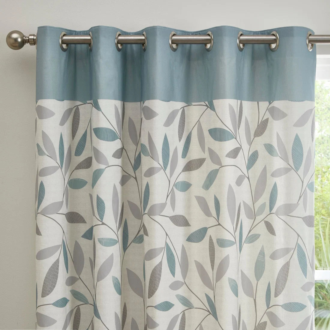Close-up of the interlocking leaf pattern on the Fusion Beechwood eyelet curtains.