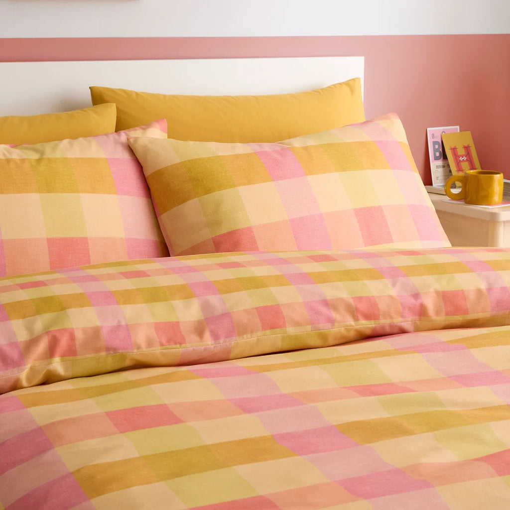 Close-up of the oversized check pattern on the Fusion Block Check duvet cover set.