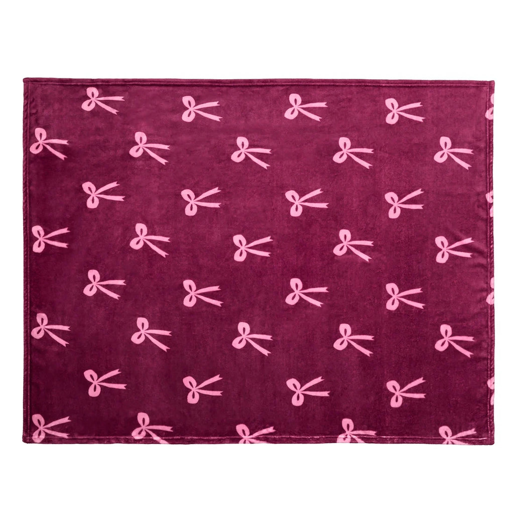 Close-up of the ribbon bow pattern on the Fusion Bows berry throw.