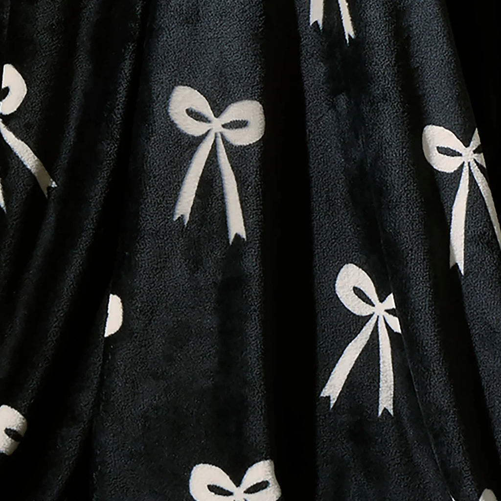 Close-up of the soft fleece fabric on the Fusion Bows monochrome throw.