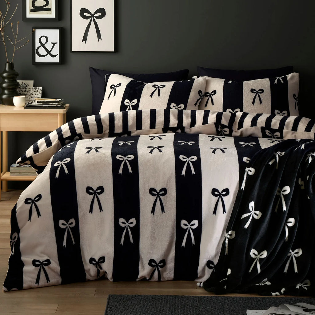 Fusion Bows monochrome duvet cover set styled in a contemporary bedroom.