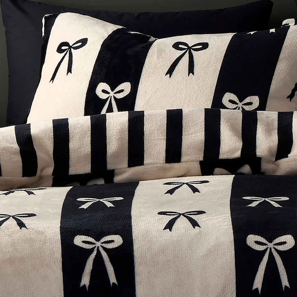 Close-up of the ribbon bow and striped design on the Fusion Bows duvet cover set.