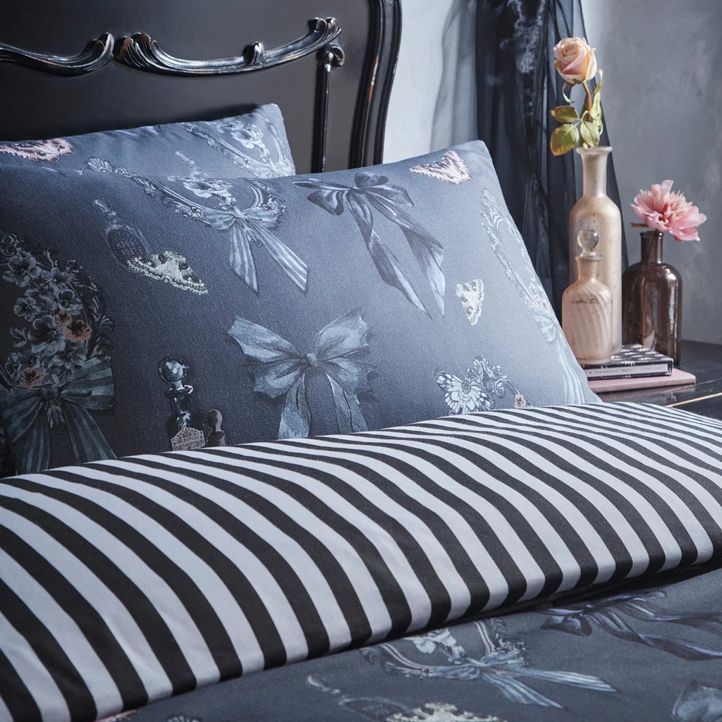 Close-up of the gothic bows, cameo frames and floral design on the Fusion Bows Noir Halloween duvet cover set.