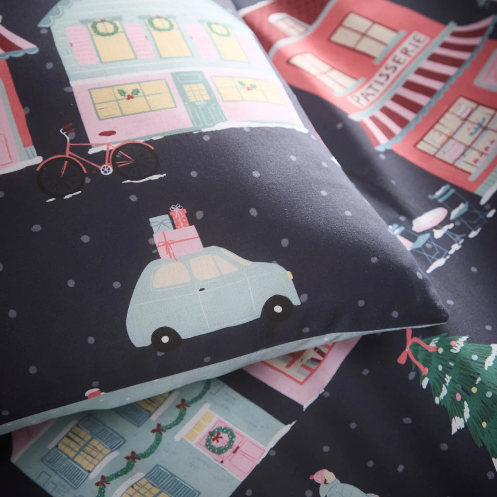 Close-up of the polycotton fabric on the Fusion Christmas Houses Navy duvet cover set.