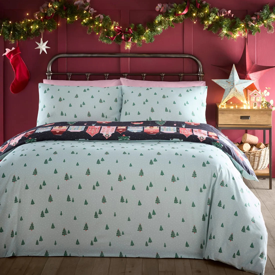 Scattered tree and dotted reverse design on the Fusion Christmas Houses duvet cover set in Navy.