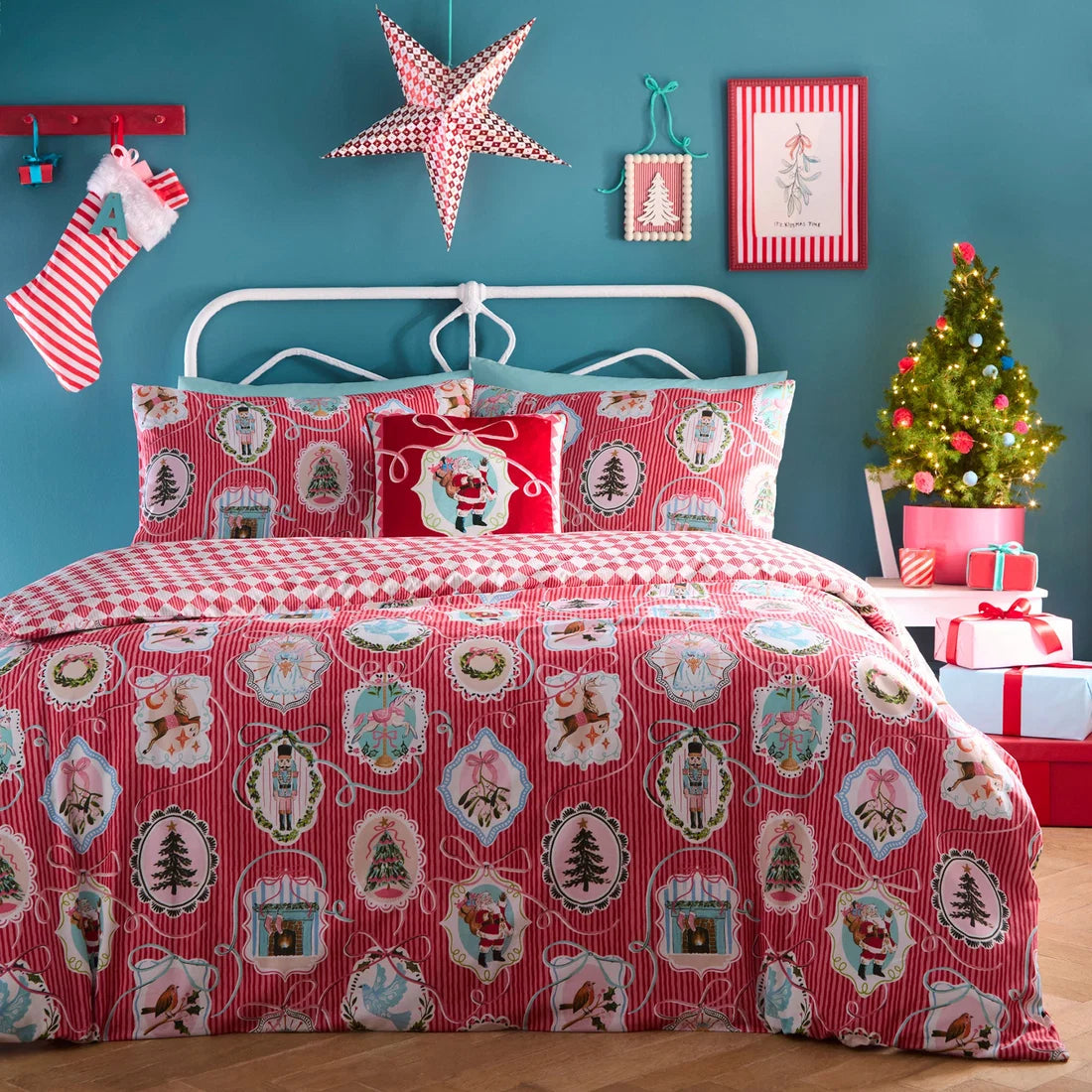 Fusion Christmas Vintage Frames red velvet cushion styled on a festive bed