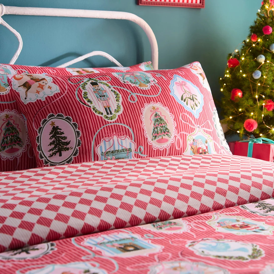 Close-up of the vintage-inspired Christmas scenes and bows on the Fusion Christmas Vintage Frames bedding.