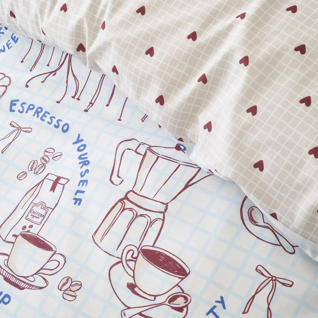 Close-up of the soft cotton-rich polycotton fabric on the Fusion Coffee Club duvet cover set.
