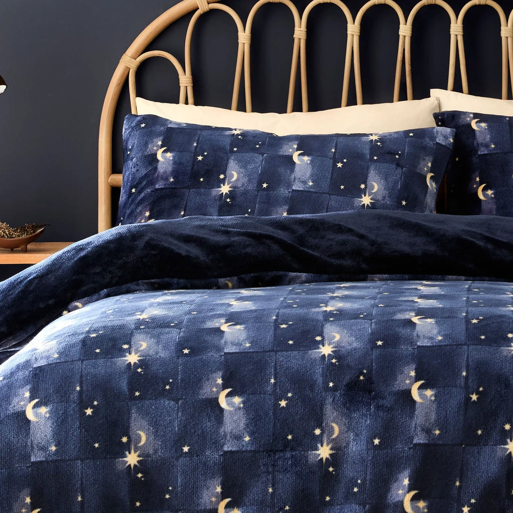 Close-up of the moon and star celestial design on the Fusion Cosmic Star duvet cover set.