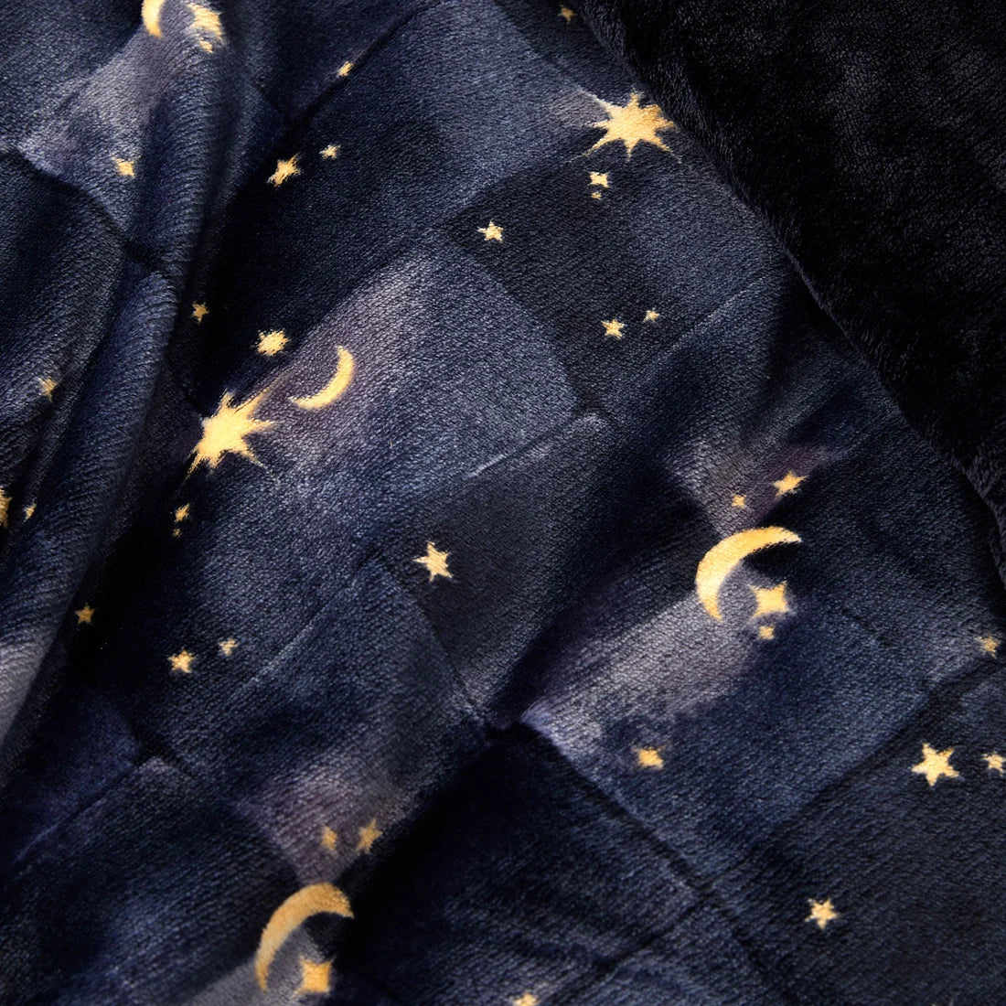 Close-up of the ultra-soft fleece and sherpa polyester fabric on the Fusion Cosmic Star duvet cover set.