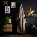 Fusion Cosy Leopard fleece throw in natural measuring 150 x 200cm.
