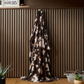 Fusion Cow Print fleece throw in chocolate with a cosy cowhide-inspired design.