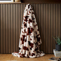 Fusion Cow Print Faux Fur bedspread in Natural 150 x 200cm with a bold cowhide-inspired design.
