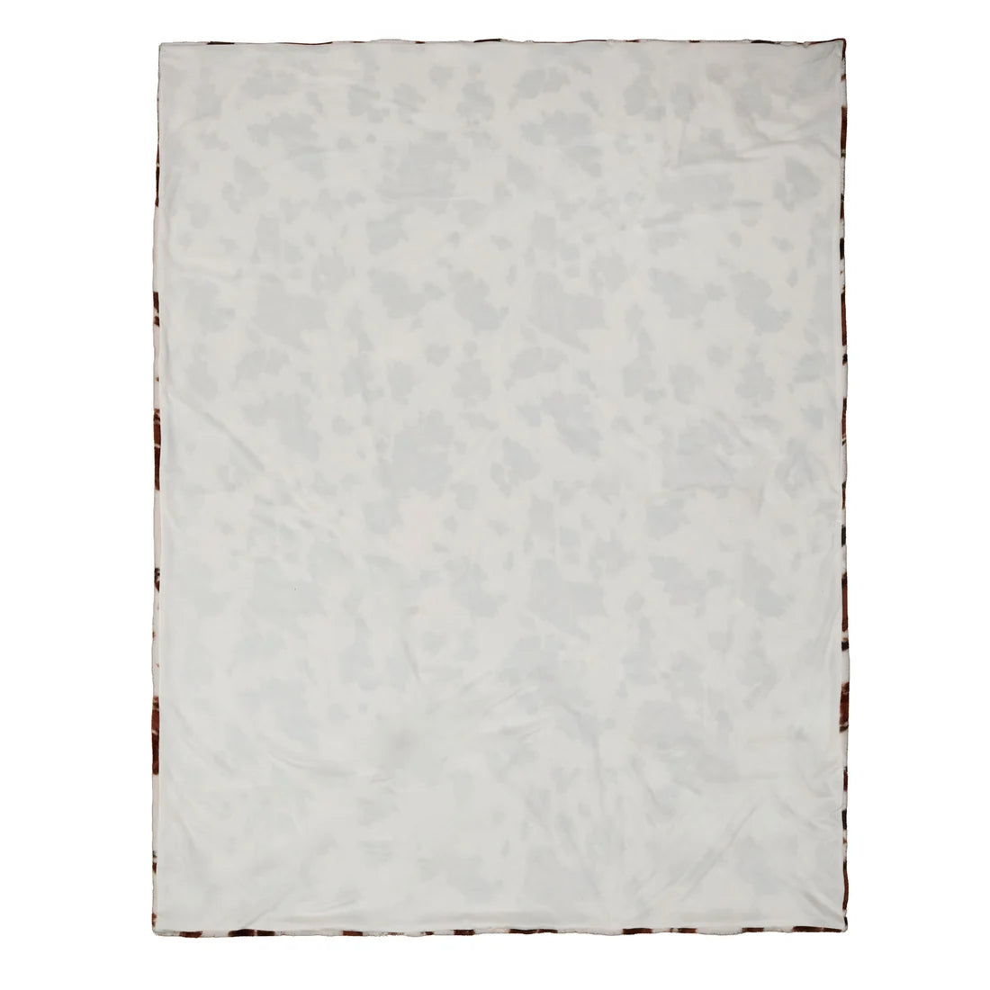 Detailed view of the Fusion Cow Print Faux Fur bedspread showing its soft textured finish.