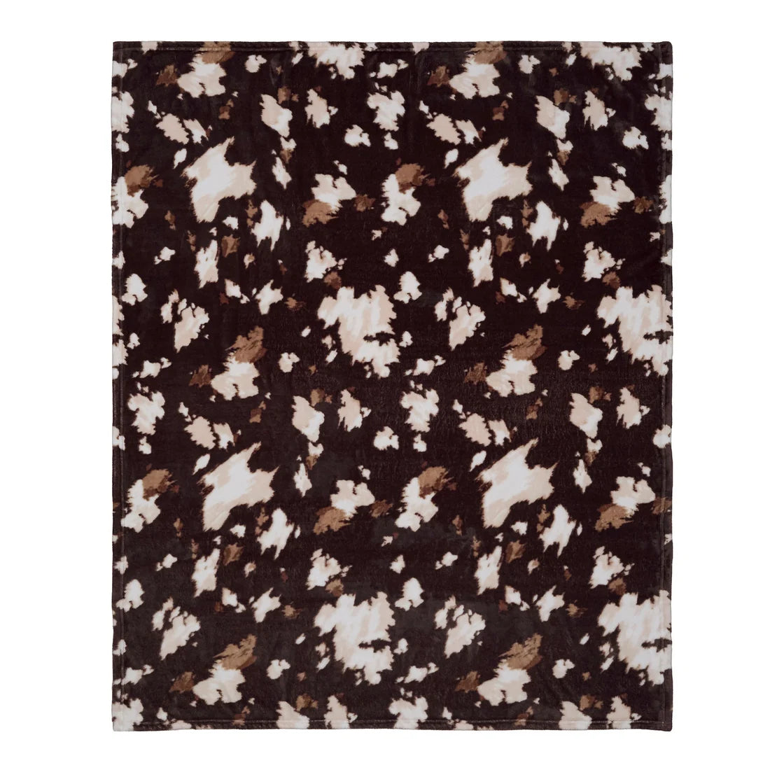 Close-up of the cow print pattern on the Fusion Chocolate fleece throw.