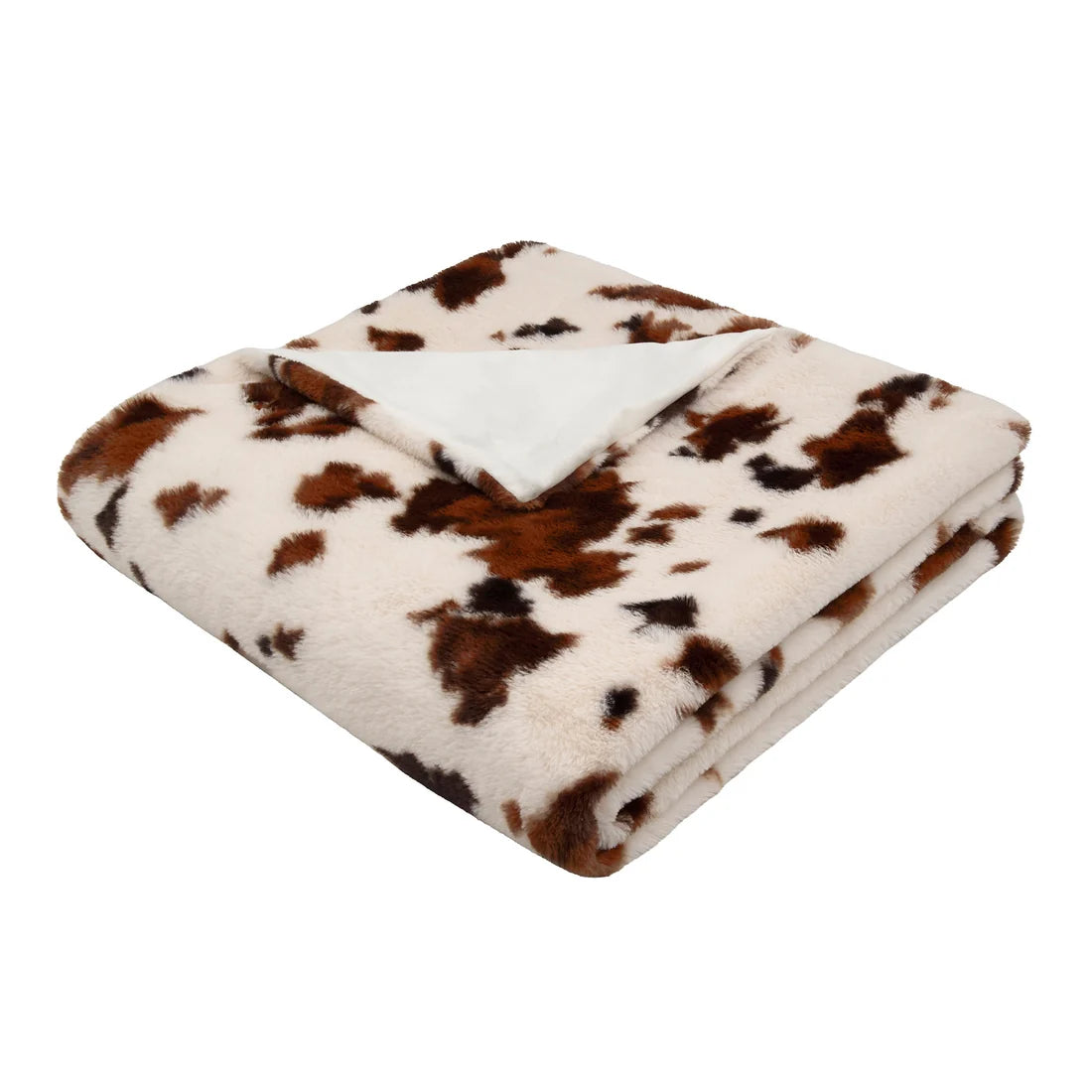 Close-up of the plush faux fur texture on the Fusion Cow Print bedspread in Natural.