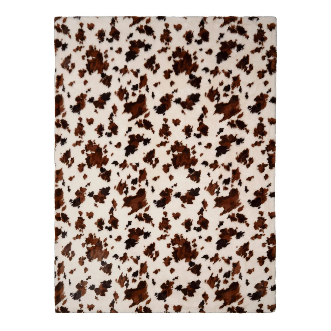 Close-up of the cowhide-inspired pattern on the Fusion Cow Print Faux Fur bedspread.
