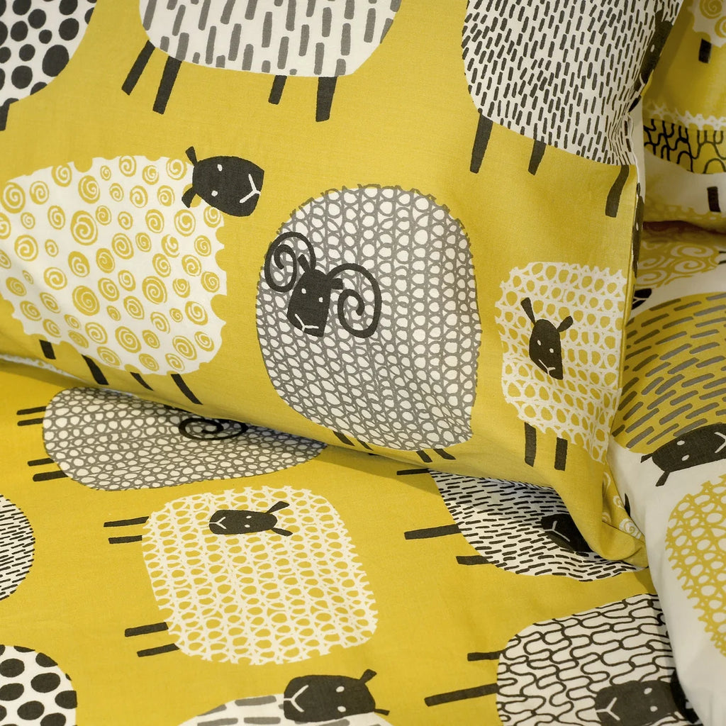 Close-up of the soft cotton-rich polycotton fabric on the Fusion Dotty Sheep duvet cover set.